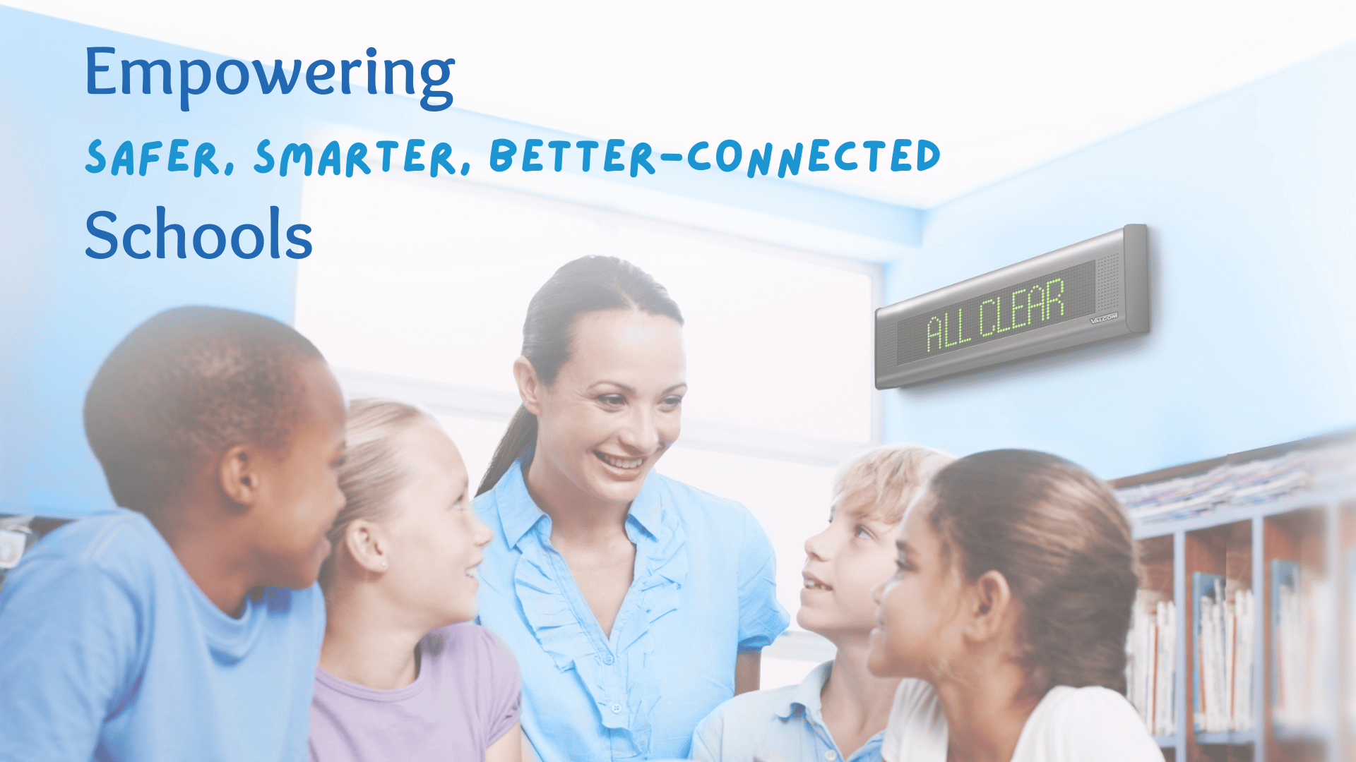 Teacher with her students looking happy because their school is empowered with safer, smarter, better-connected technology for mass communications, safety and emergencies.