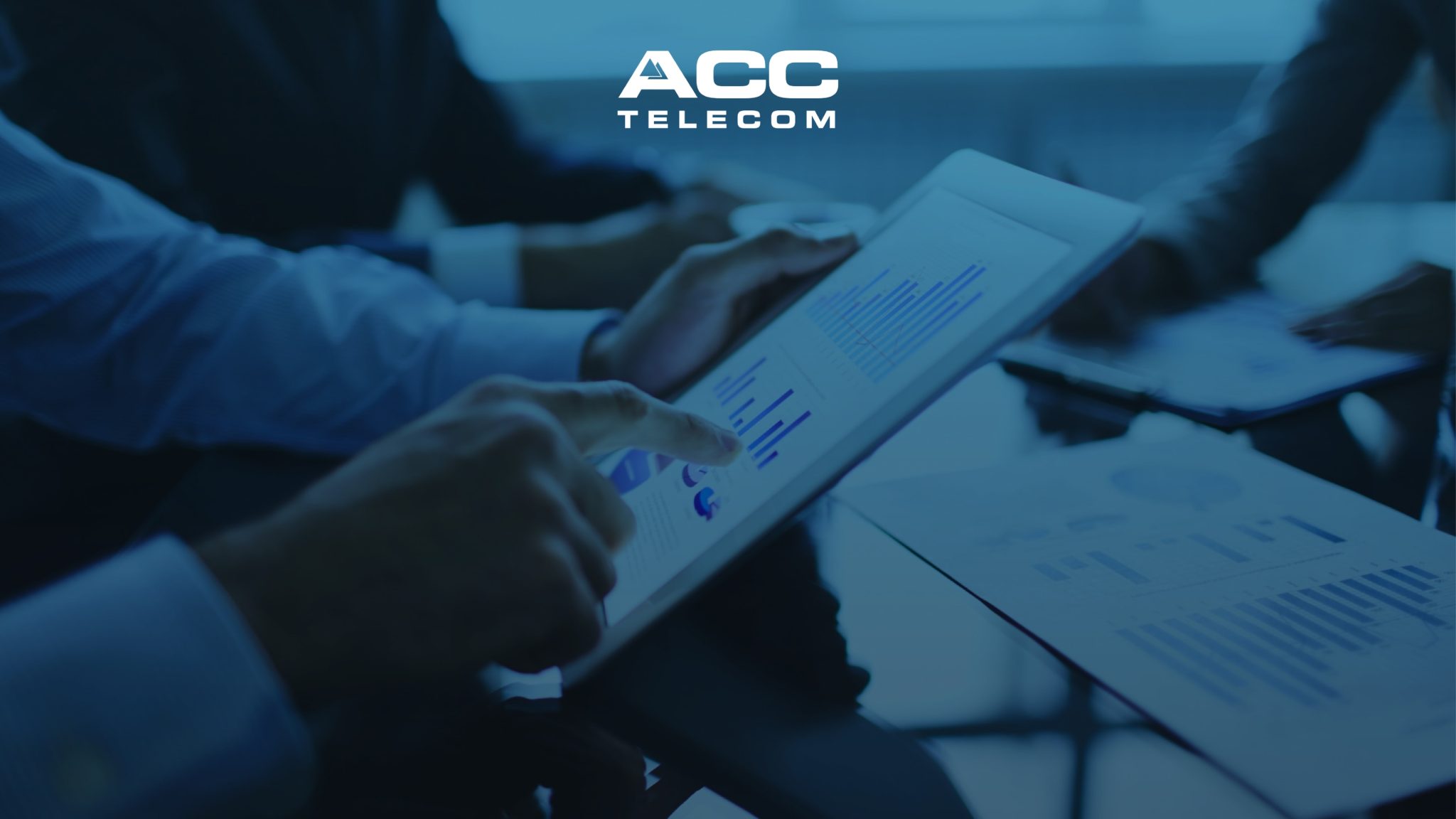 Close-up of hands using a tablet with data charts, reflecting communication infrastructure that supports screen sharing and essential business tools.